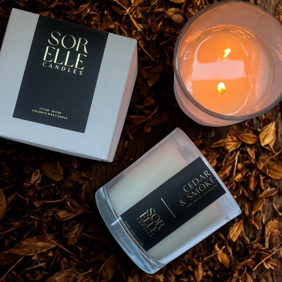 Hand-poured Cedar & Smoke coconut soy wax candle with cedar, charcoal, and frankincense notes — masculine fall fragrance in glass jar