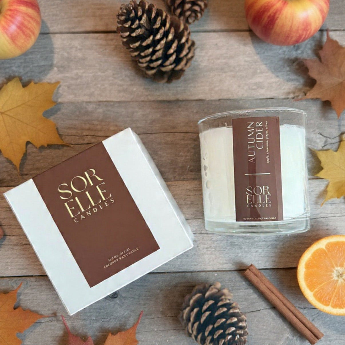 Sorelle autumn cider glass candle. coconut soy wax. brown label gold foil. 