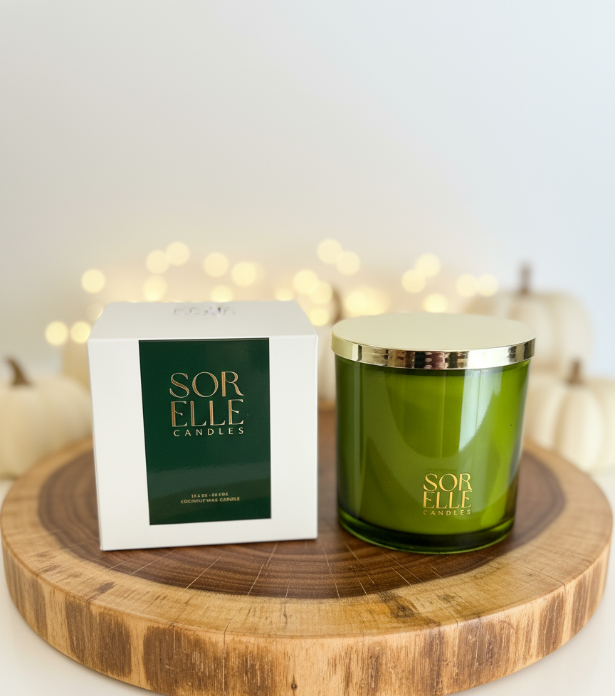 Glass balsam forest sorelle coconut soy wax candle with gold lid Candles packaging on a wooden stand with blurred lights in the background