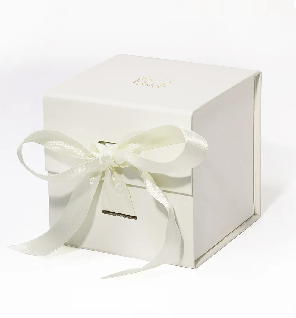 Sorelle Candles ivory magnetic gift box with gold foil logo and cream satin ribbon