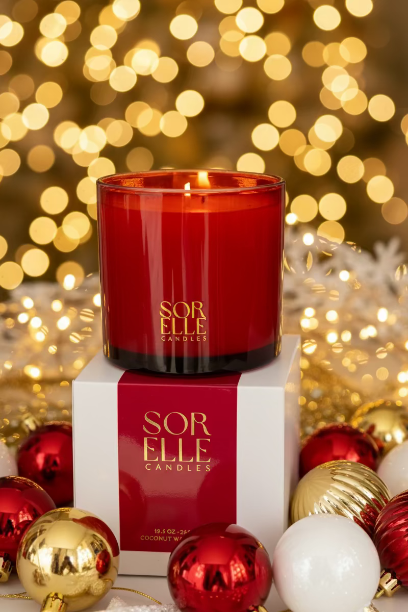 Red glass Christmas candle, gold sorelle logo. Coconut soy wax christmas candle